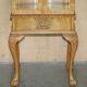 Pair of Art Deco display cabinets circa 1920 in light walnut with Cabriolet legs.