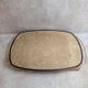 Large vintage 1960s platter with floral decoration on a black background and golden handles.