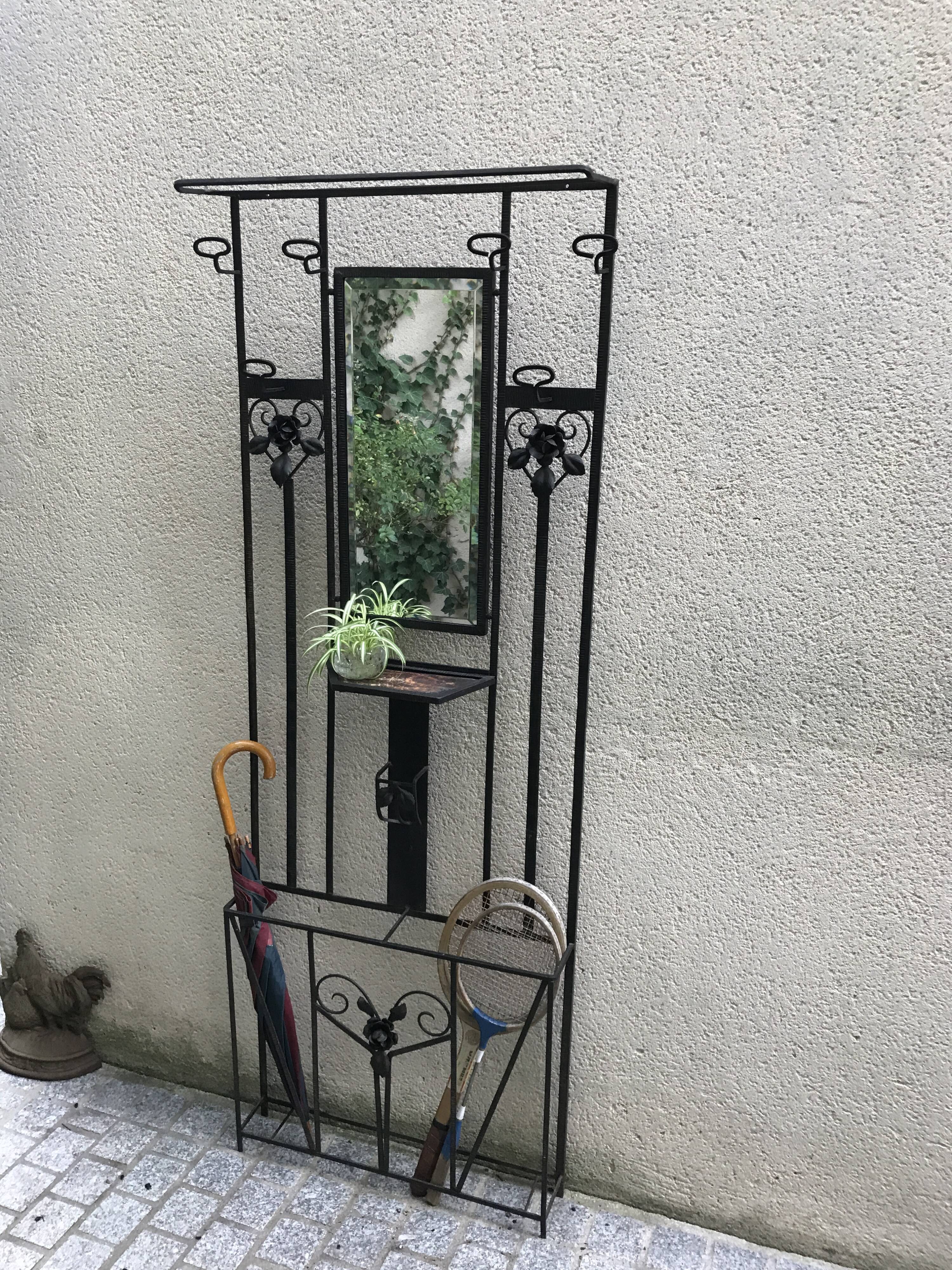 Wrought iron coat holder with 1930