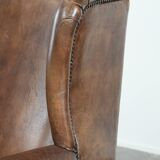 Warm, cosy and comfortable vintage sheepskin ear armchair with character