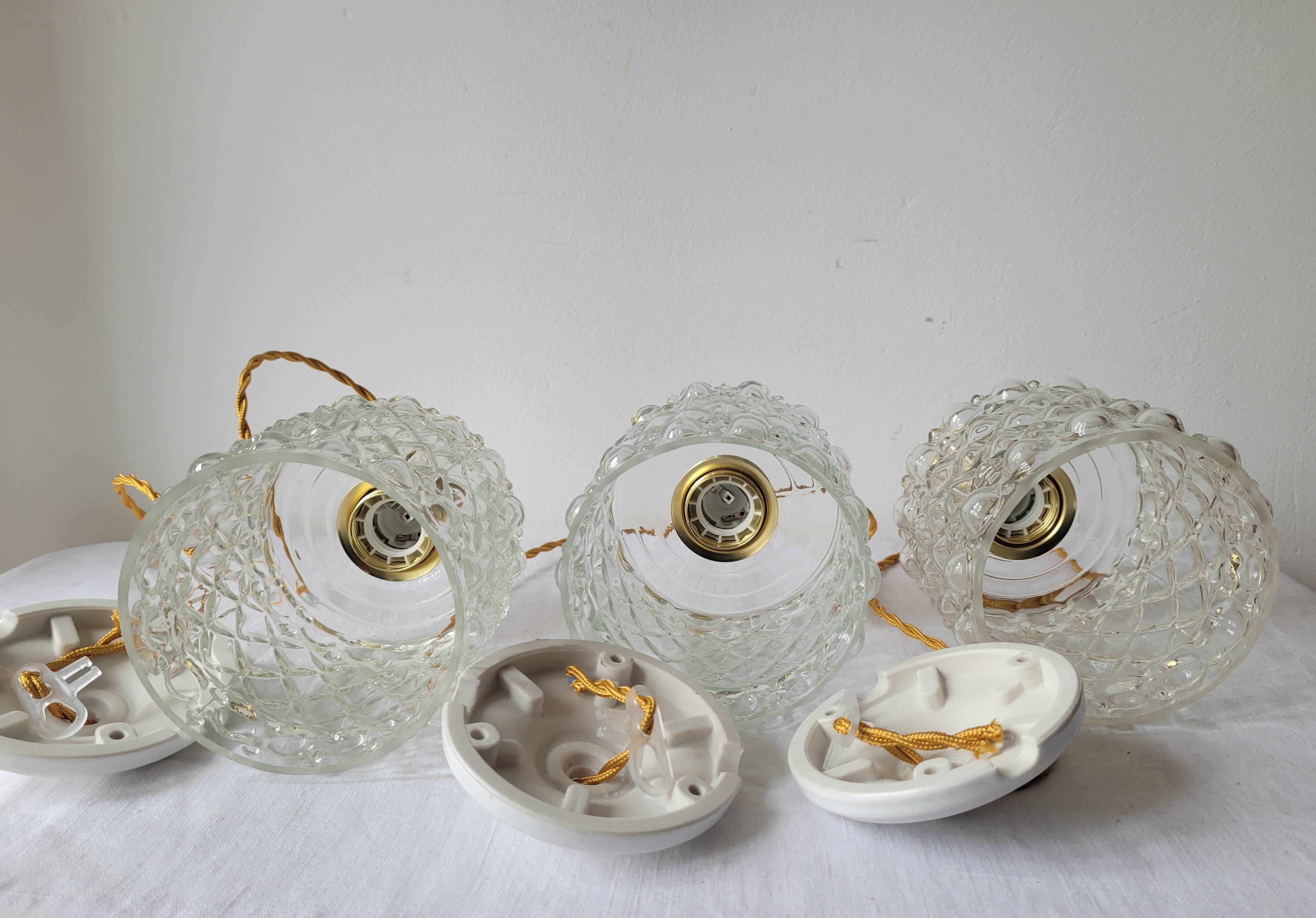 Trio of molded glass pendant lights