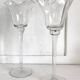 Pair of glass candlesticks on a stand