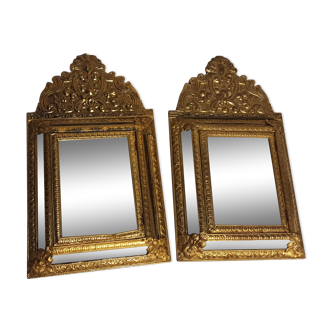 Pair of mirrors with repelled brass parecloses 35x61cm