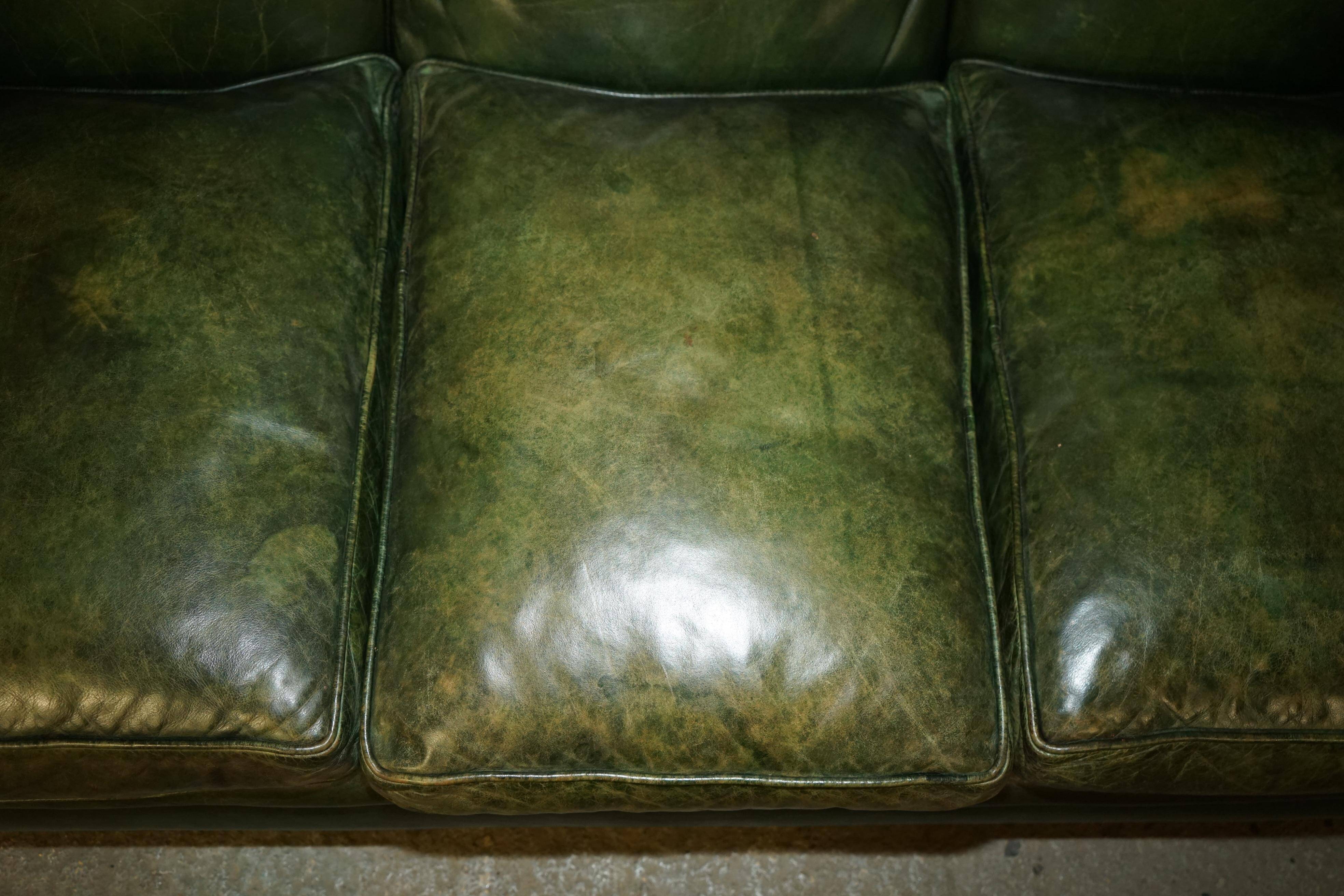 Victorian leather canapé, shield armrests, stamped Maple & Co.