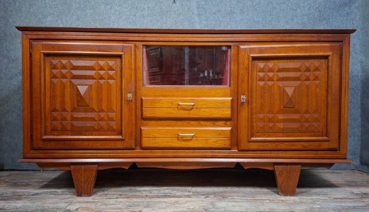 Low buffet in carved oak, Art Deco style, circa 1930.