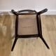 Set of 5 wooden chairs with white faux leather.