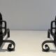 Pair of Wrought Iron Andirons with Obelisk and Belt Motifs