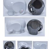 Two iridescent black and white ceramic elephants design