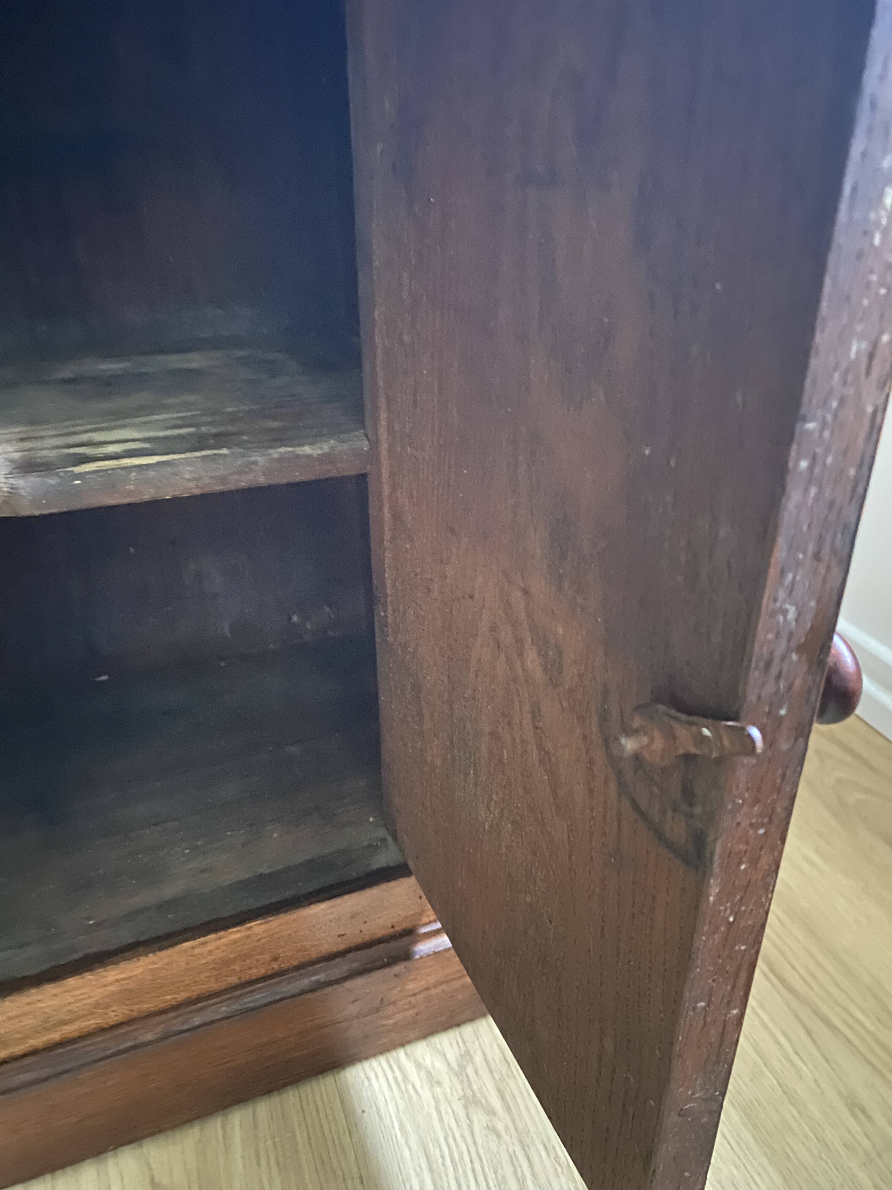 Vintage bedside table in the shape of a wooden column and a gray marble top