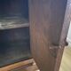 Vintage bedside table in the shape of a wooden column and a gray marble top