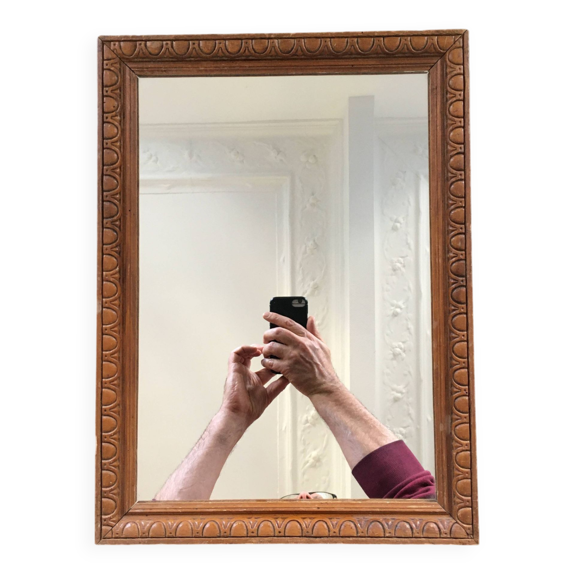 Antique mirror in ornate wood