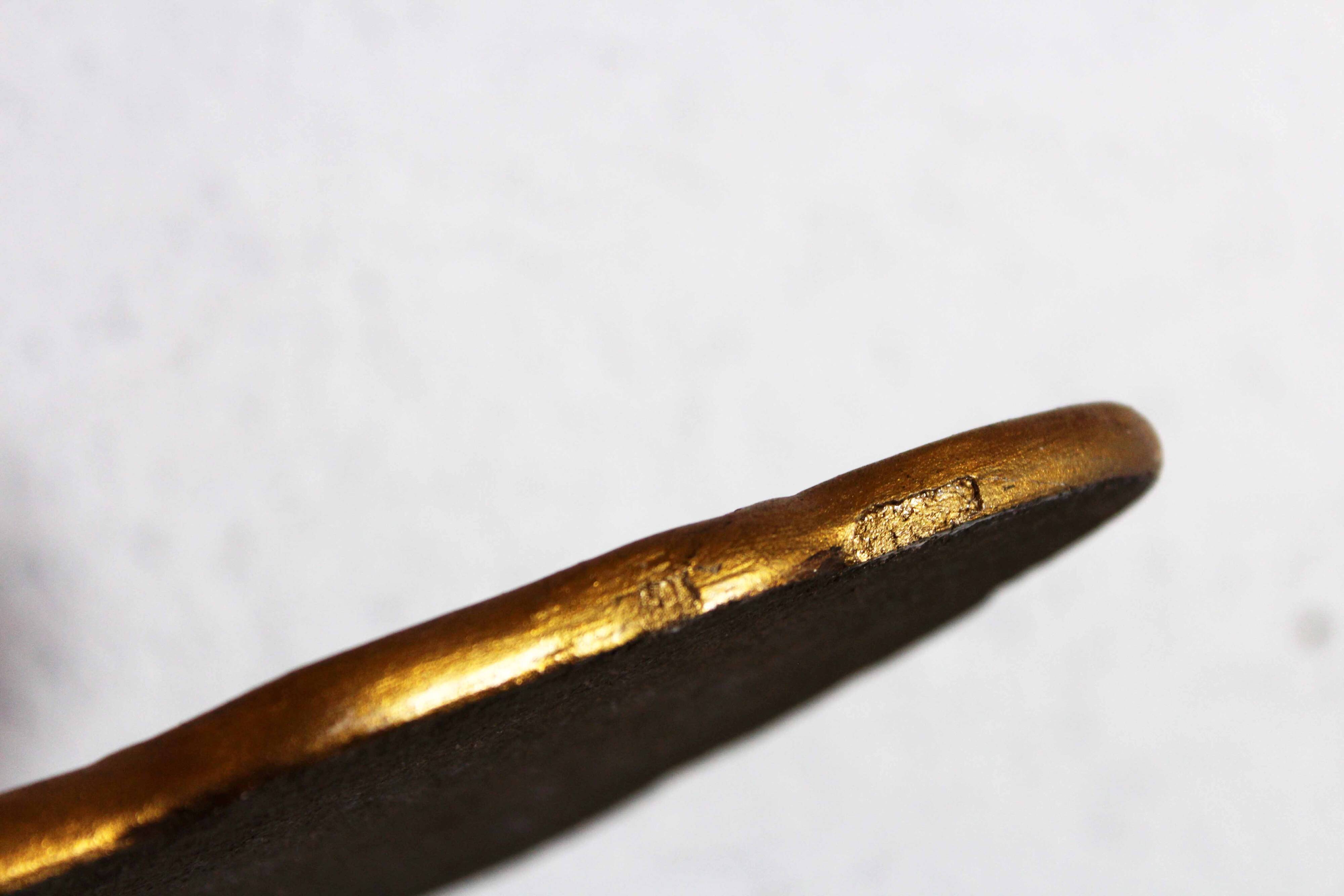 Golden mirror with decor