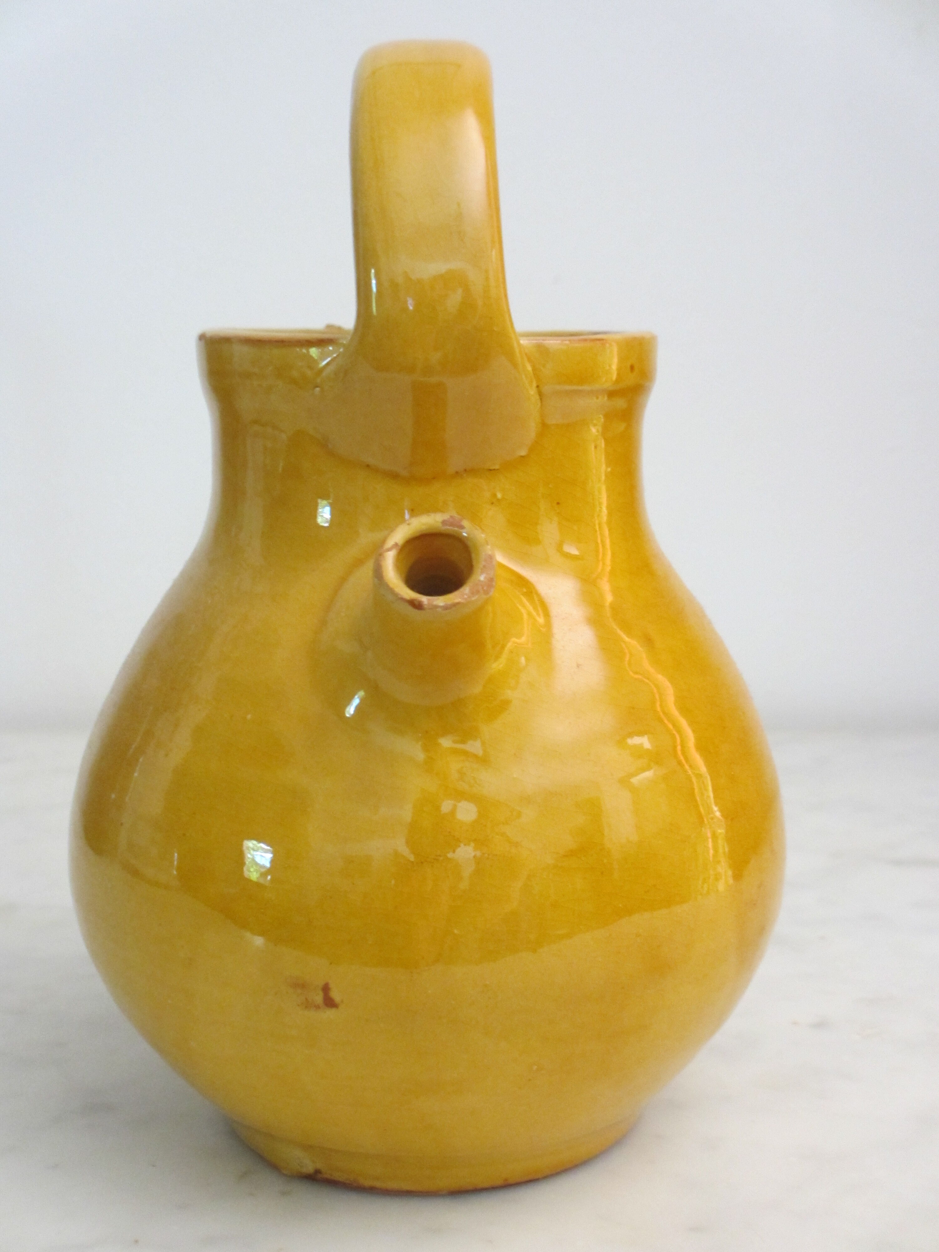 Enamelled terracotta jug