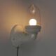 Wall lamp in porcelain with a transparent glass shade, 1930s.