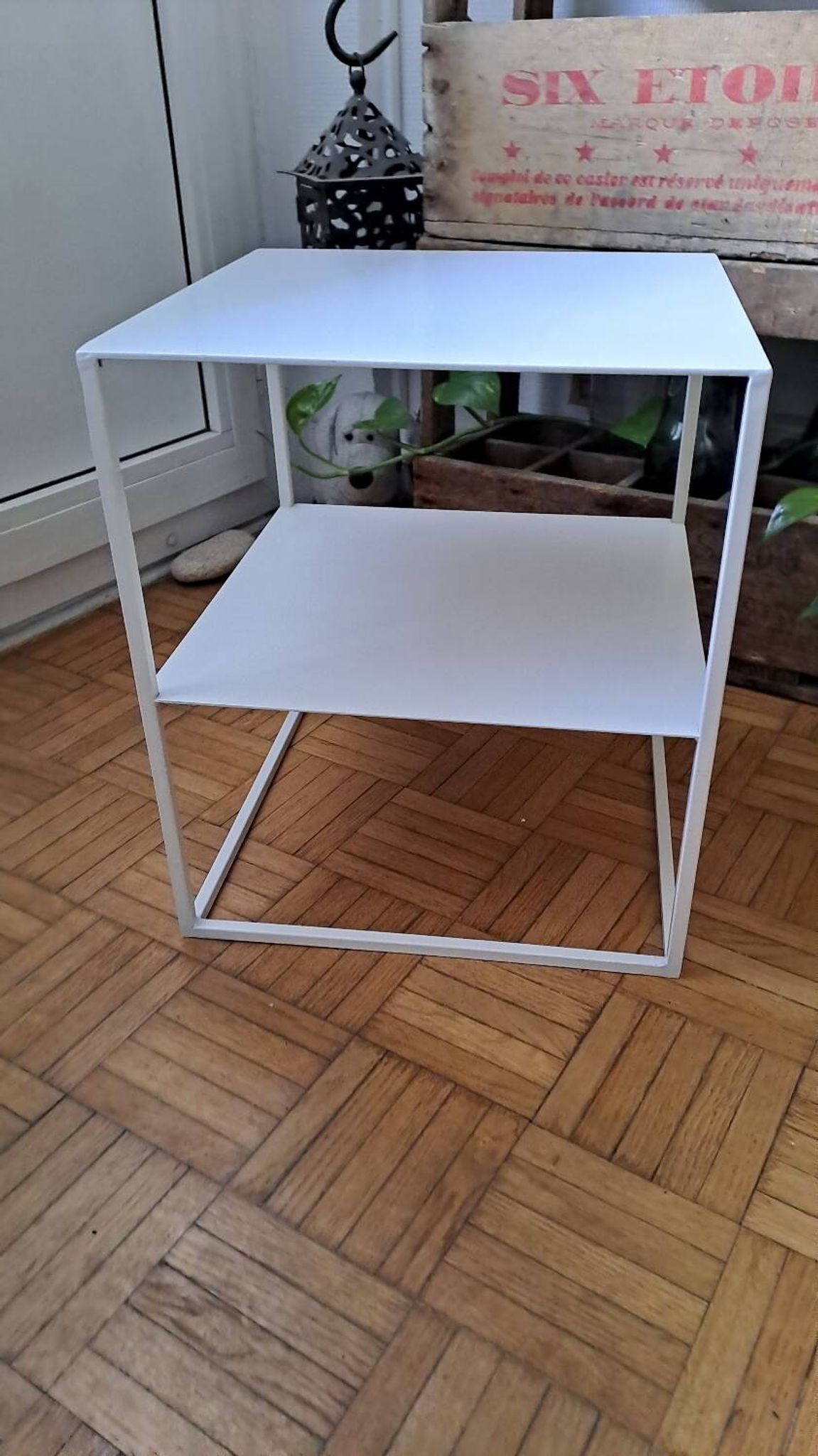 Metal coffee table with two levels.