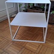 Metal coffee table with two levels.