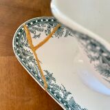 Ancienne saucière réparée avec la technique japonaise du kintsugi