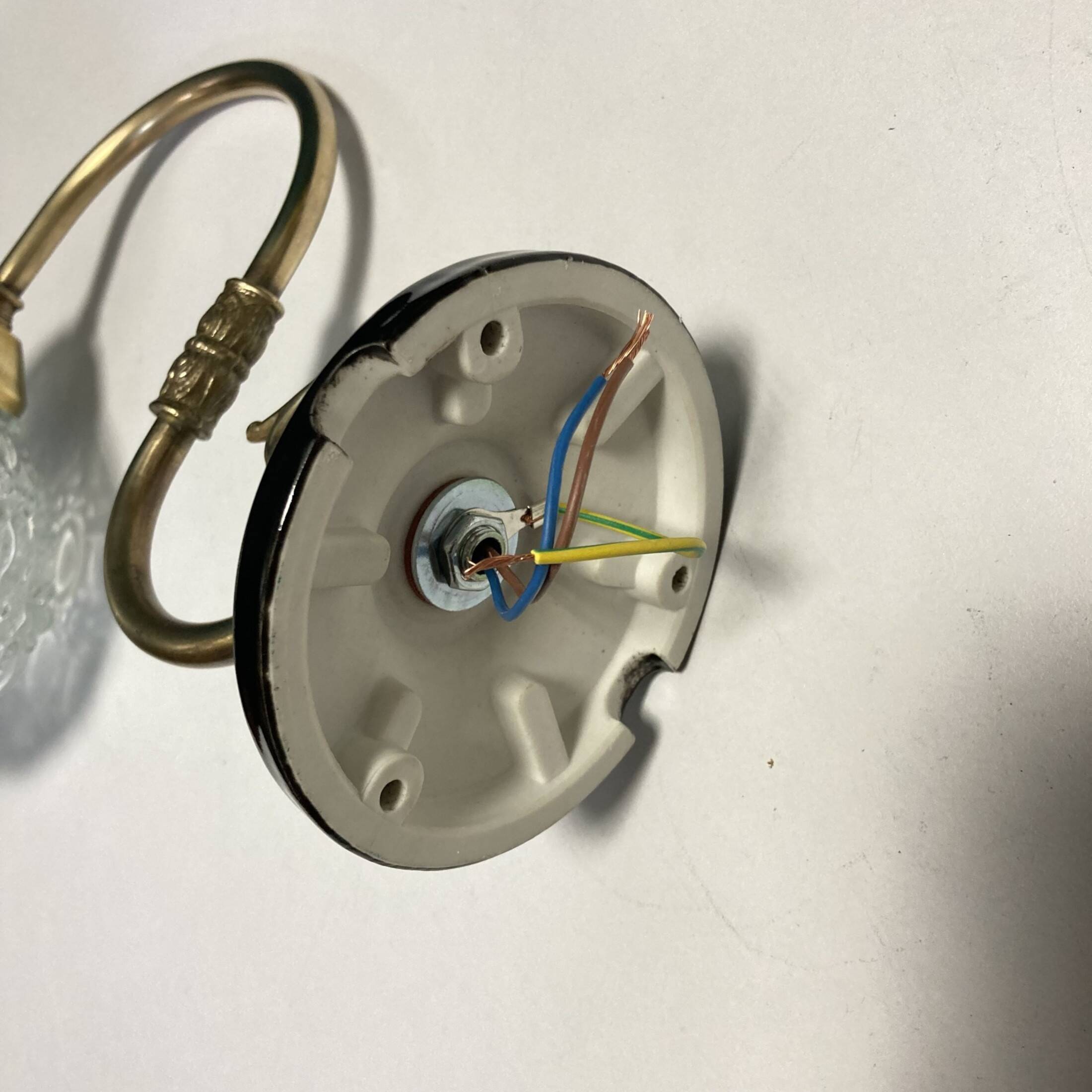 Pair of old swan neck wall lights in brass and transparent glass globe