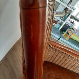 Armchair in woven rattan and exotic wood