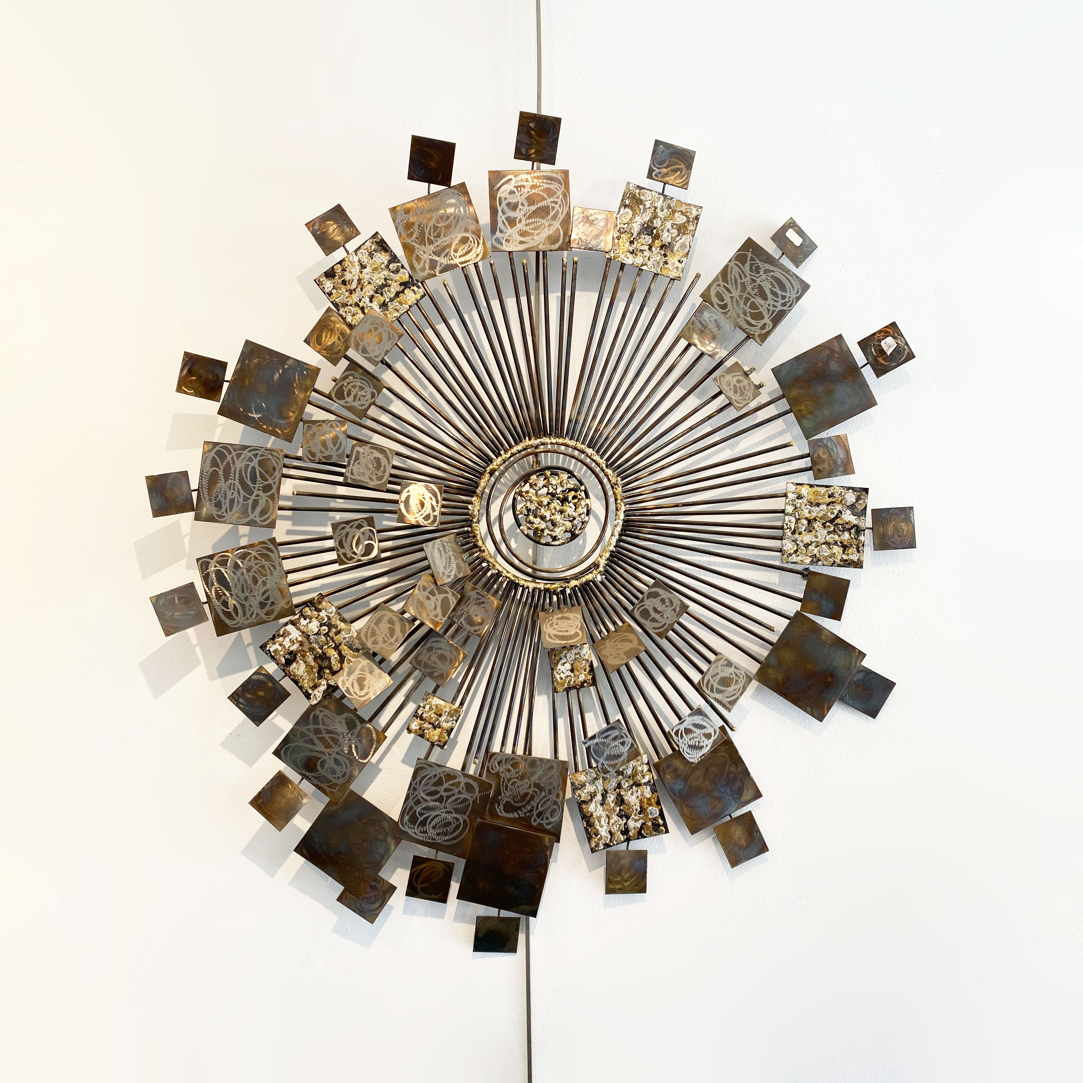 Brutalist Sunburst wall sculpture by Curtis Jere. USA, 2000s