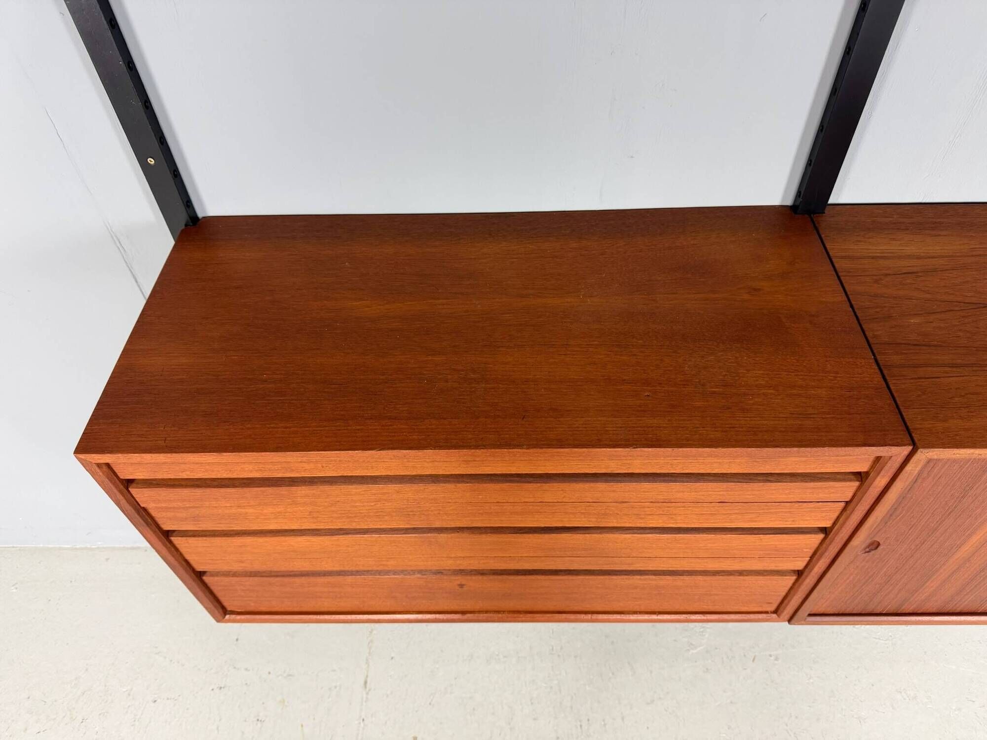 Modular wall shelf in teak in mid-century modern style, designed by Poul Cadovius for Cado, 1960.