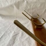 Vintage wooden wall-mounted coat rack with 3 golden cast aluminum hooks