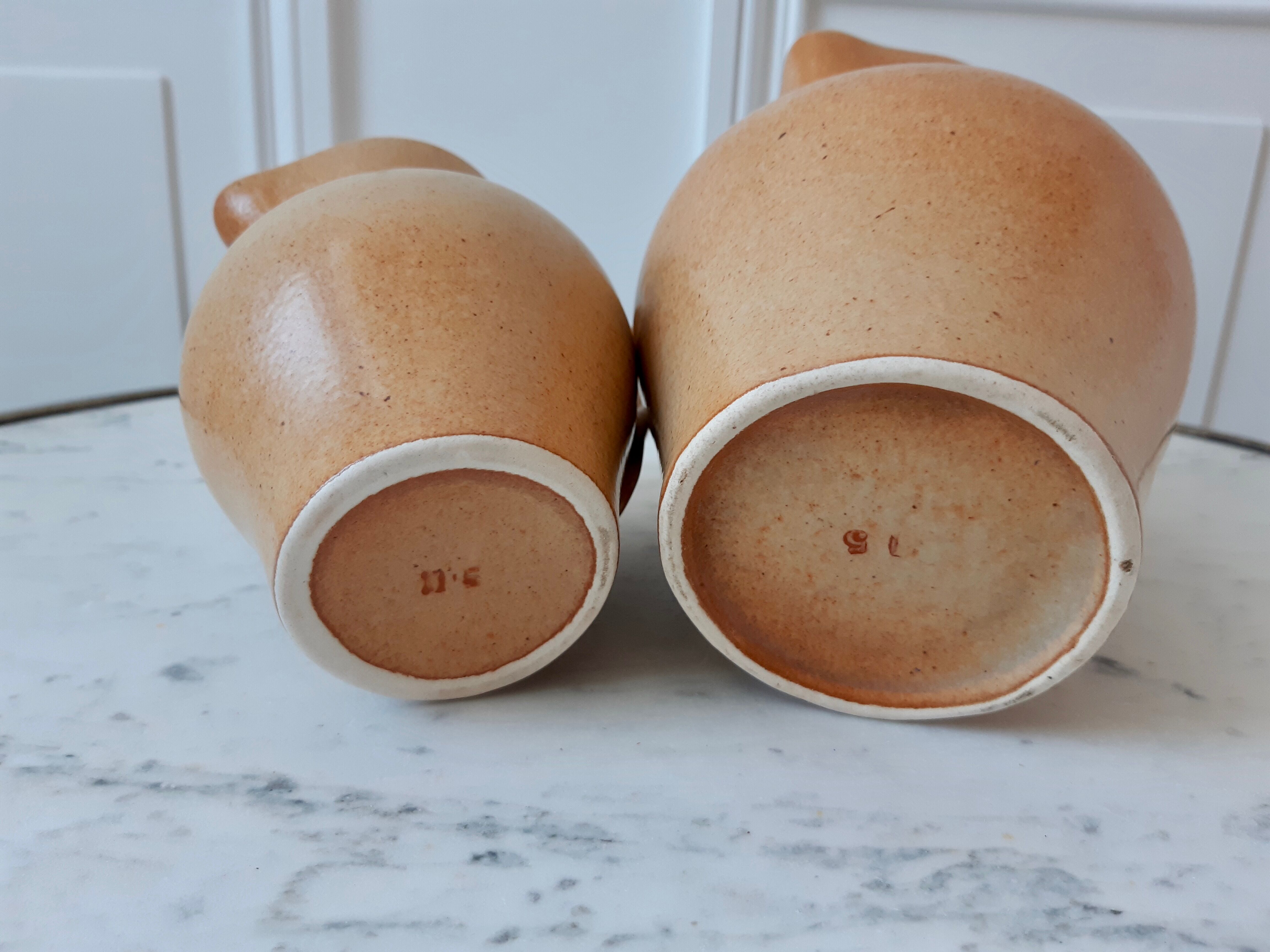 Duo of vintage sandstone pitchers Made In France