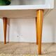 Vintage bedside table with tapered legs - white