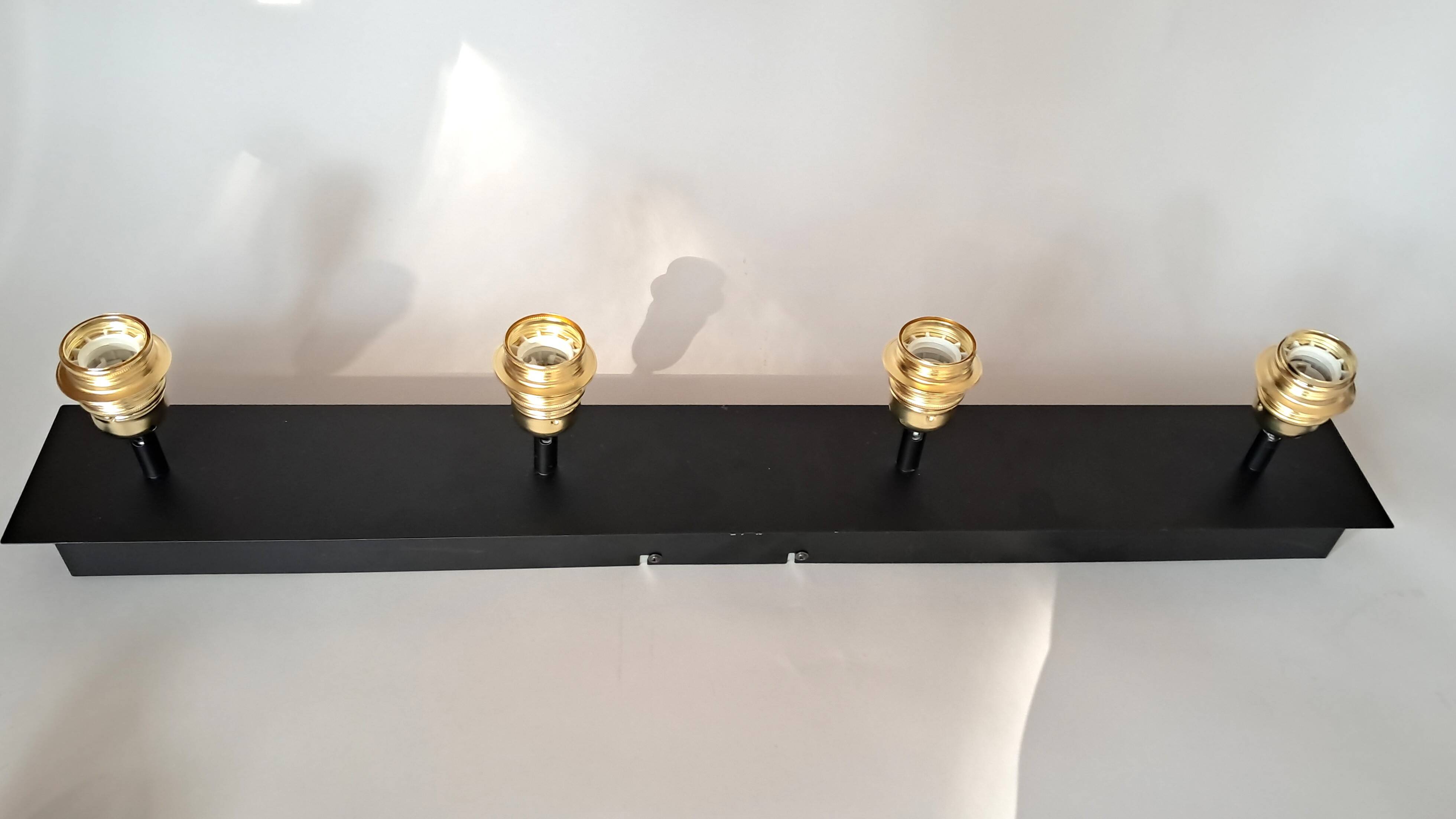 Wall lamp with 4 adjustable lights in black metal and gold-plated brass sockets.