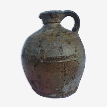 Ancient jug in glazed sandstone