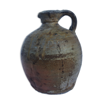 Ancient jug in glazed sandstone