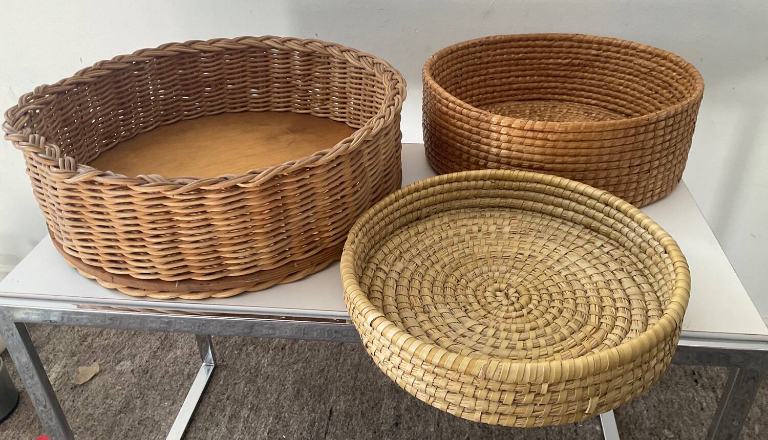 Trio of vintage wicker and woven raffia baskets