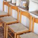 4 solid pine chairs, straw seats, shaped backrest.