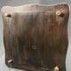Longwy earthenware trivet on blackened wooden frame