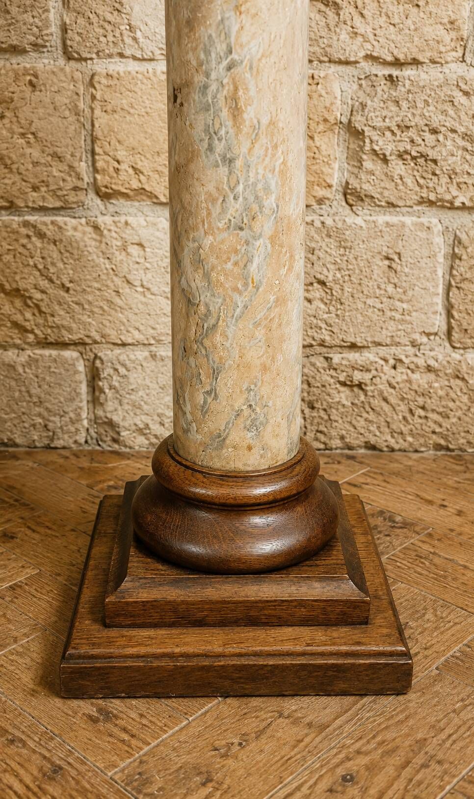 Wood and lacquer pedestal column table mimicking marble, 19th century.