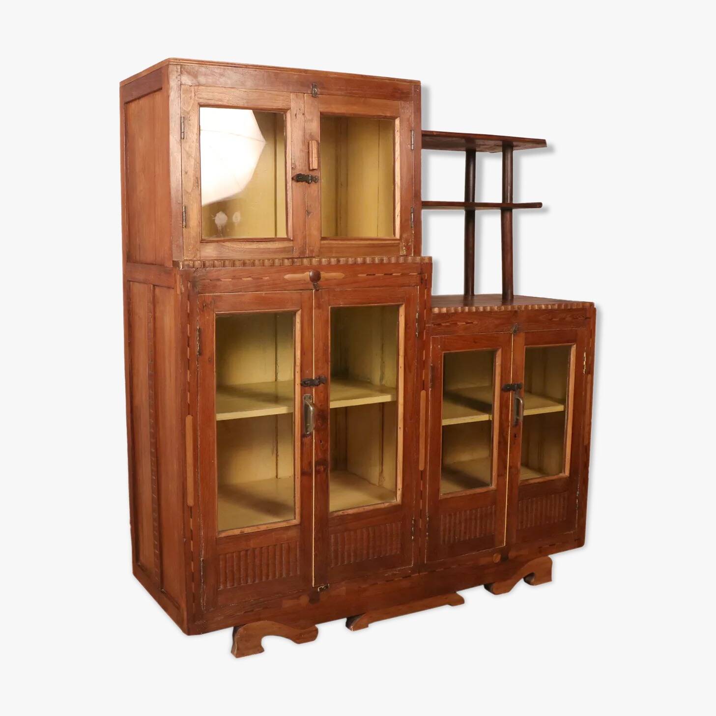 Antique Art Deco display cabinet in Burmese teak with original yellow patina interior.