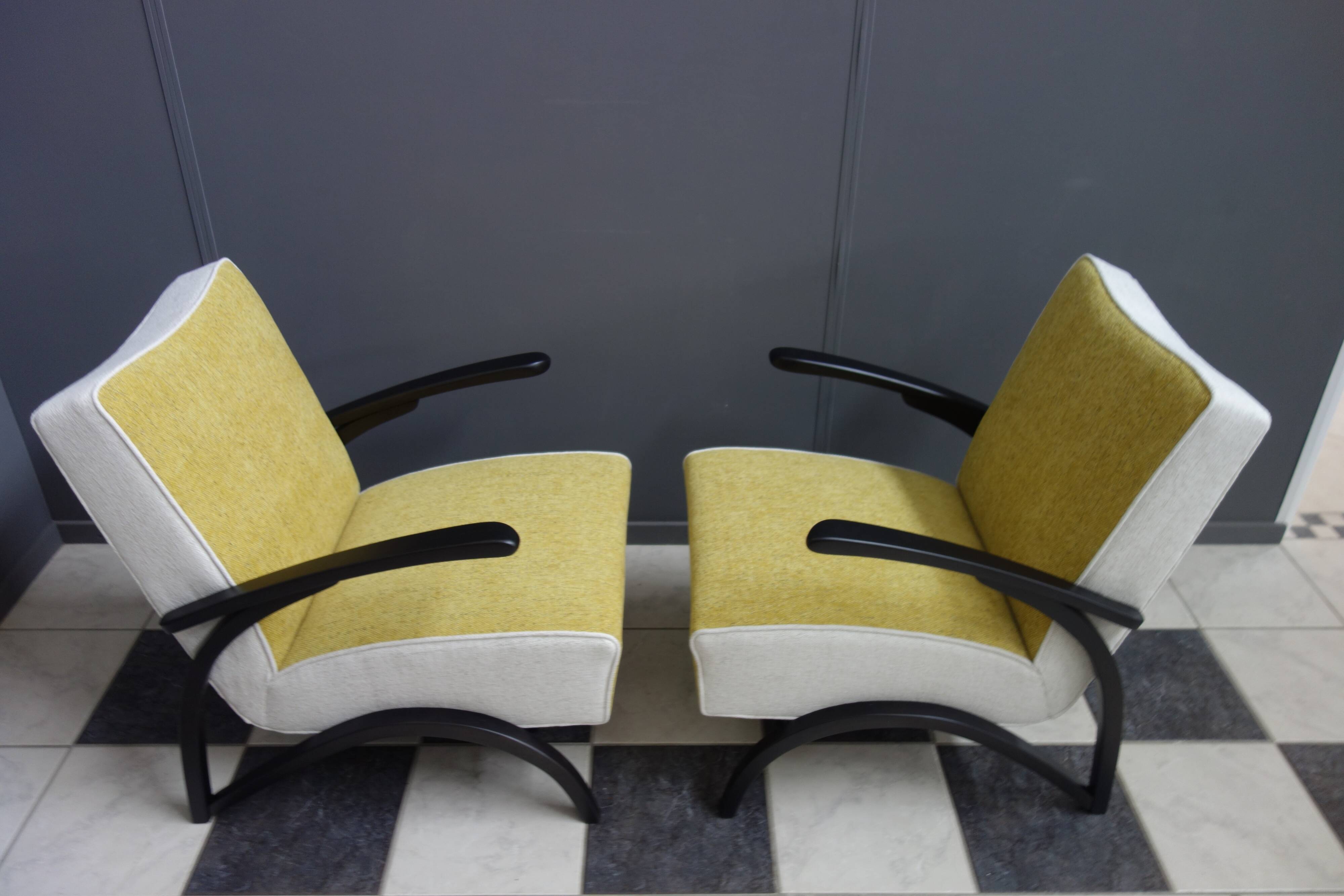 Jindrich halabala chairs yellow and white