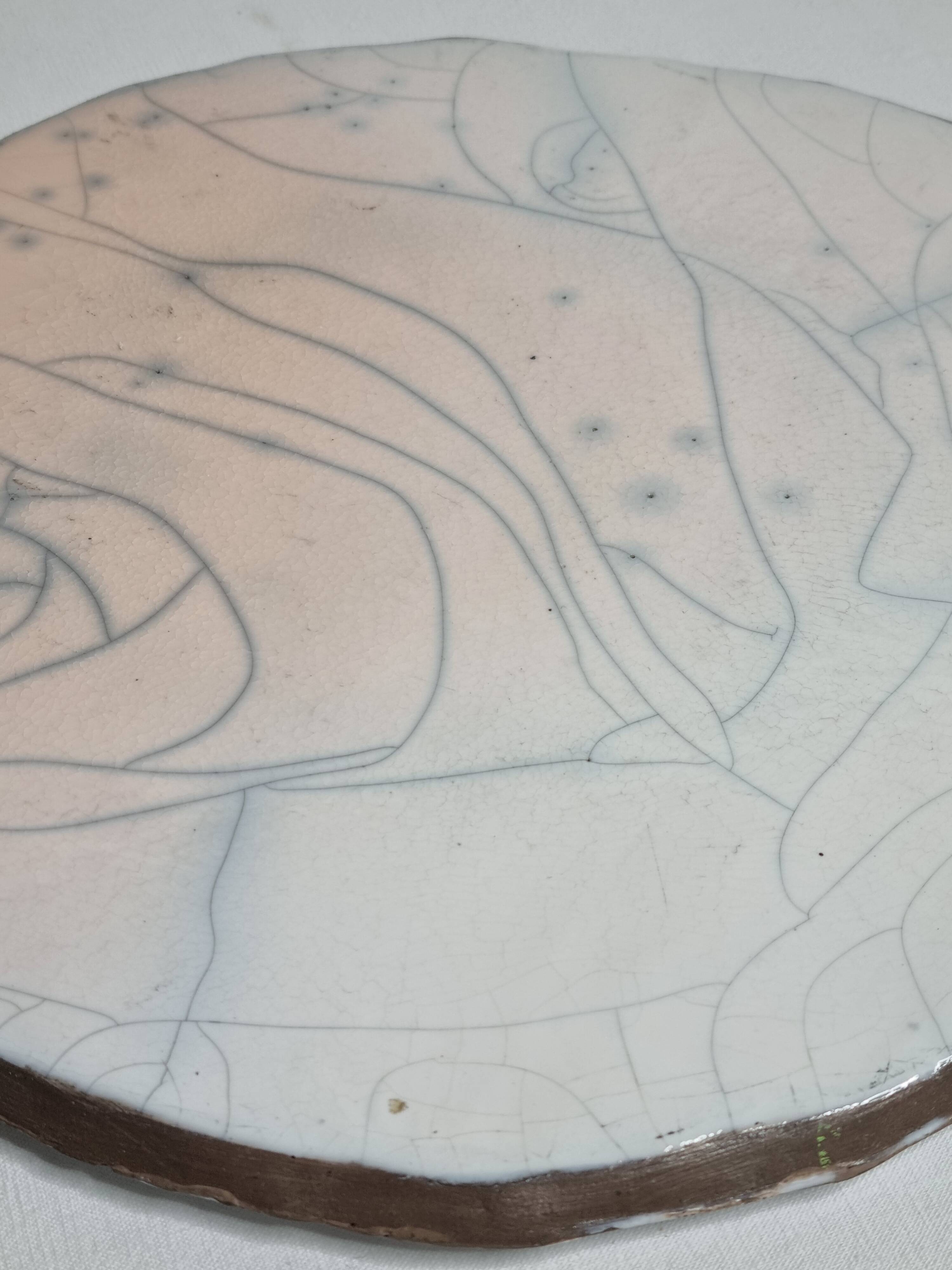 Raku ceramic presentation dish with abstract decoration, 31 cm
