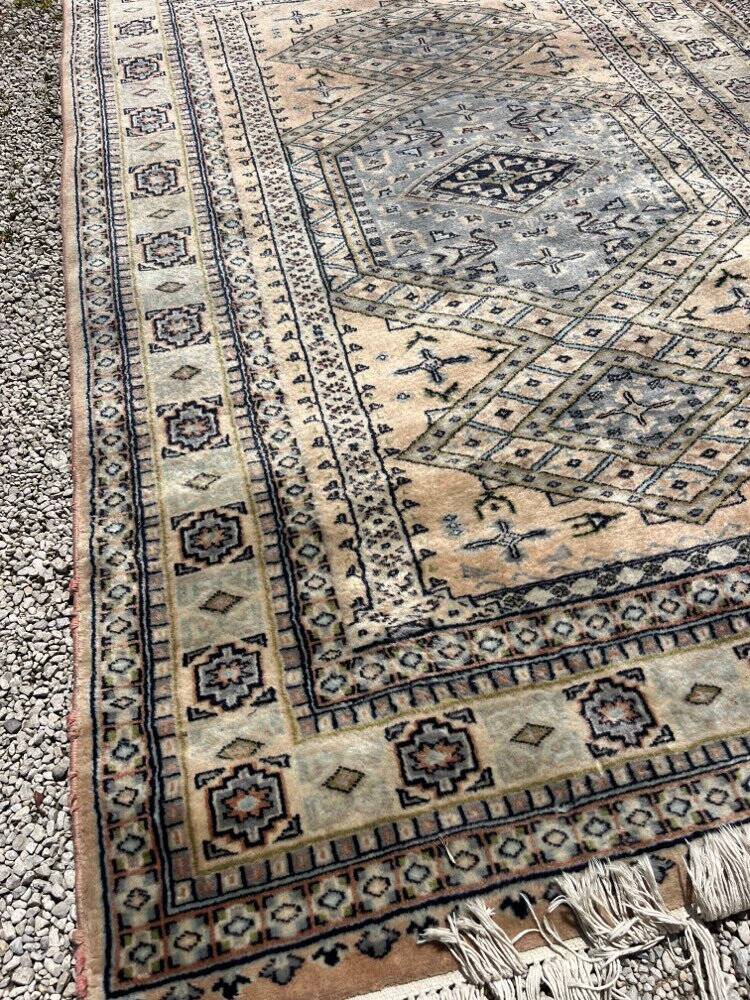 Antique Persian carpet made of wool.