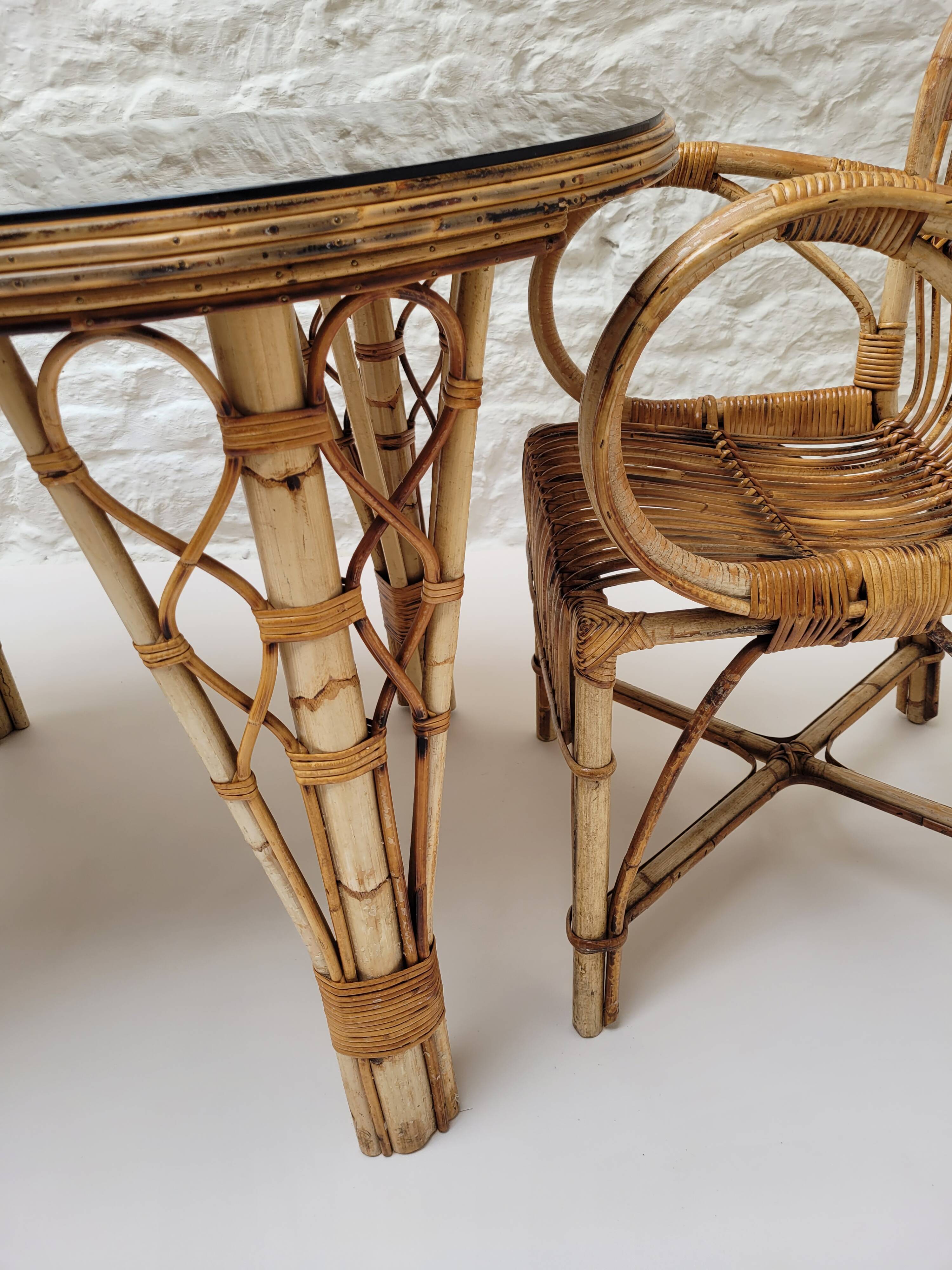 Vintage Audoux Minet bamboo, rattan, and smoked glass table duo.