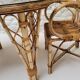 Vintage Audoux Minet bamboo, rattan, and smoked glass table duo.