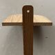 Small wall-mounted wooden shelf