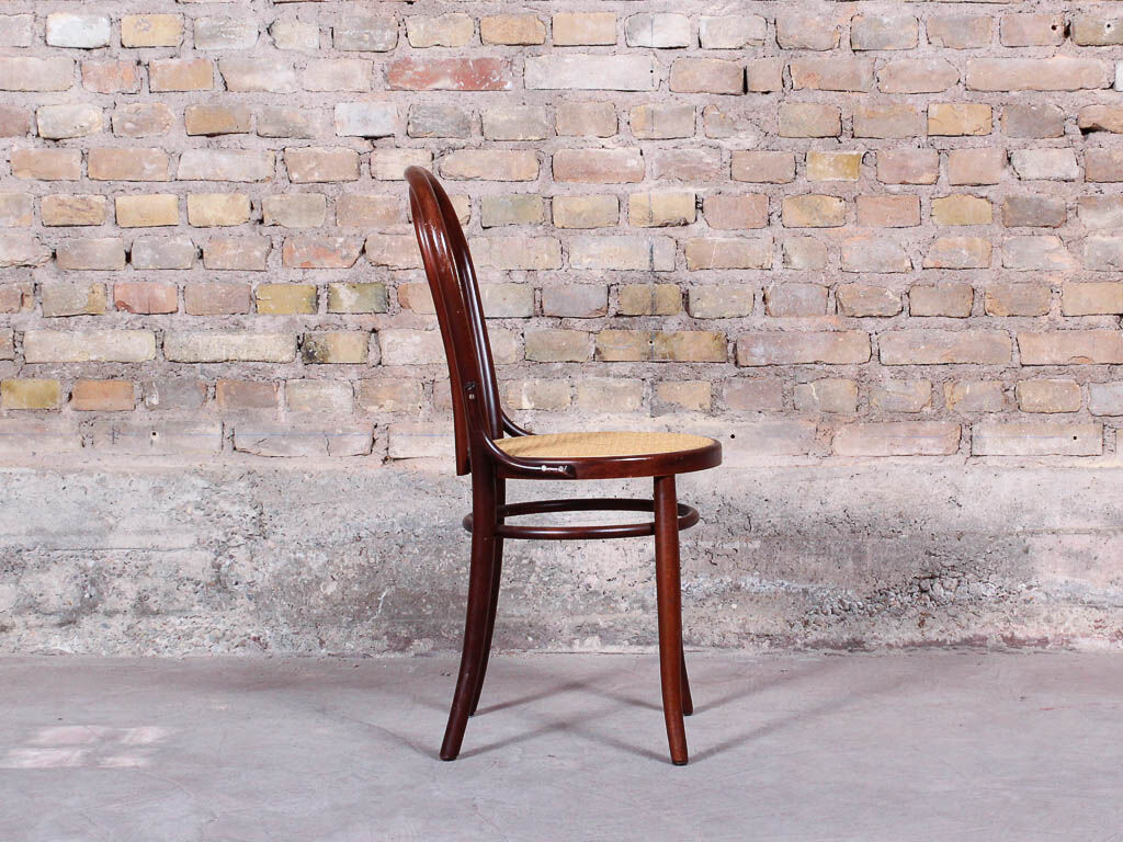 Curved wooden chair and tuna-