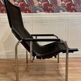 Black leather reclining lounge chair, "Hans Eichenberger" design, 1960.