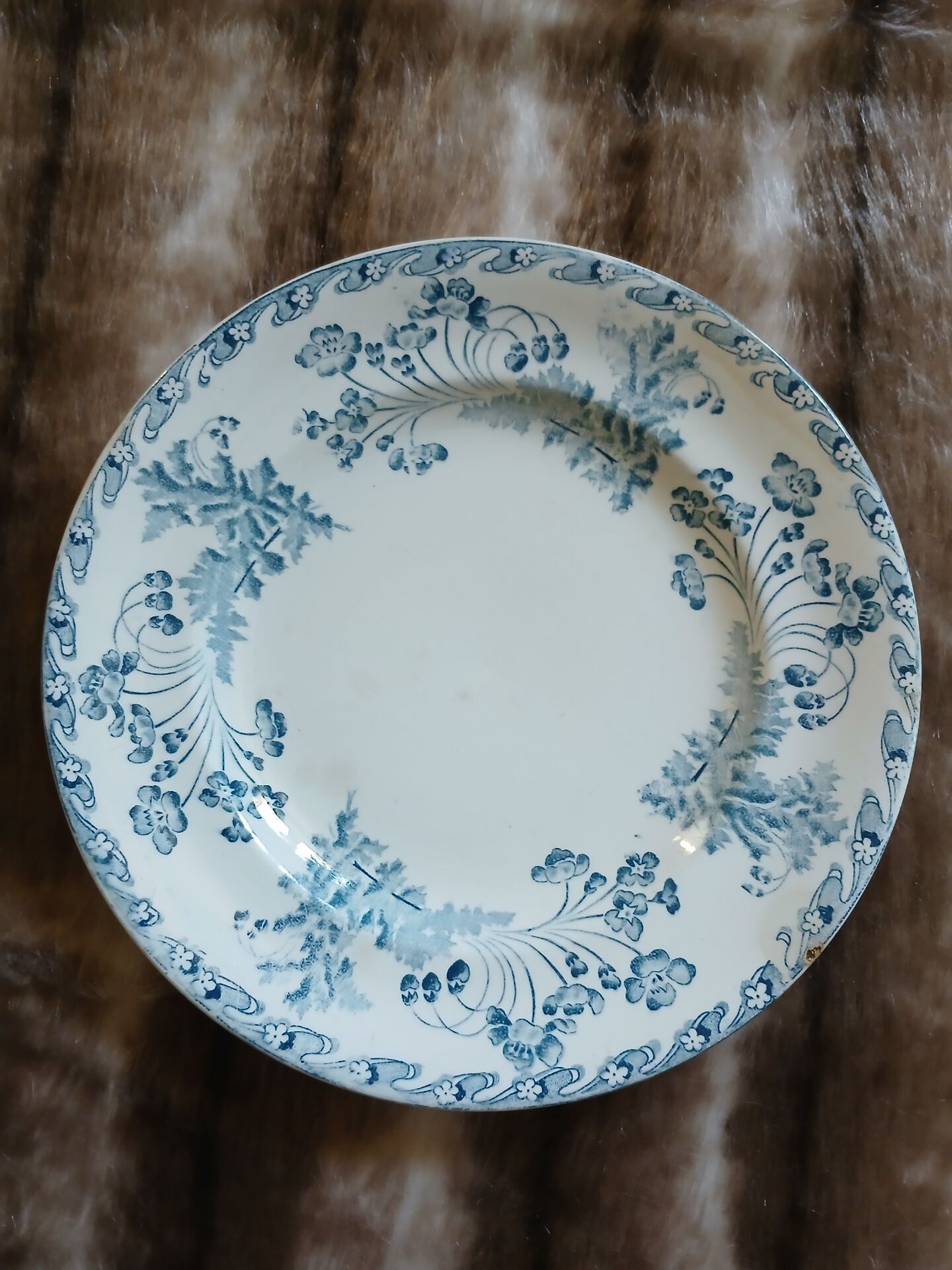 13 mismatched flat plates in ironstone