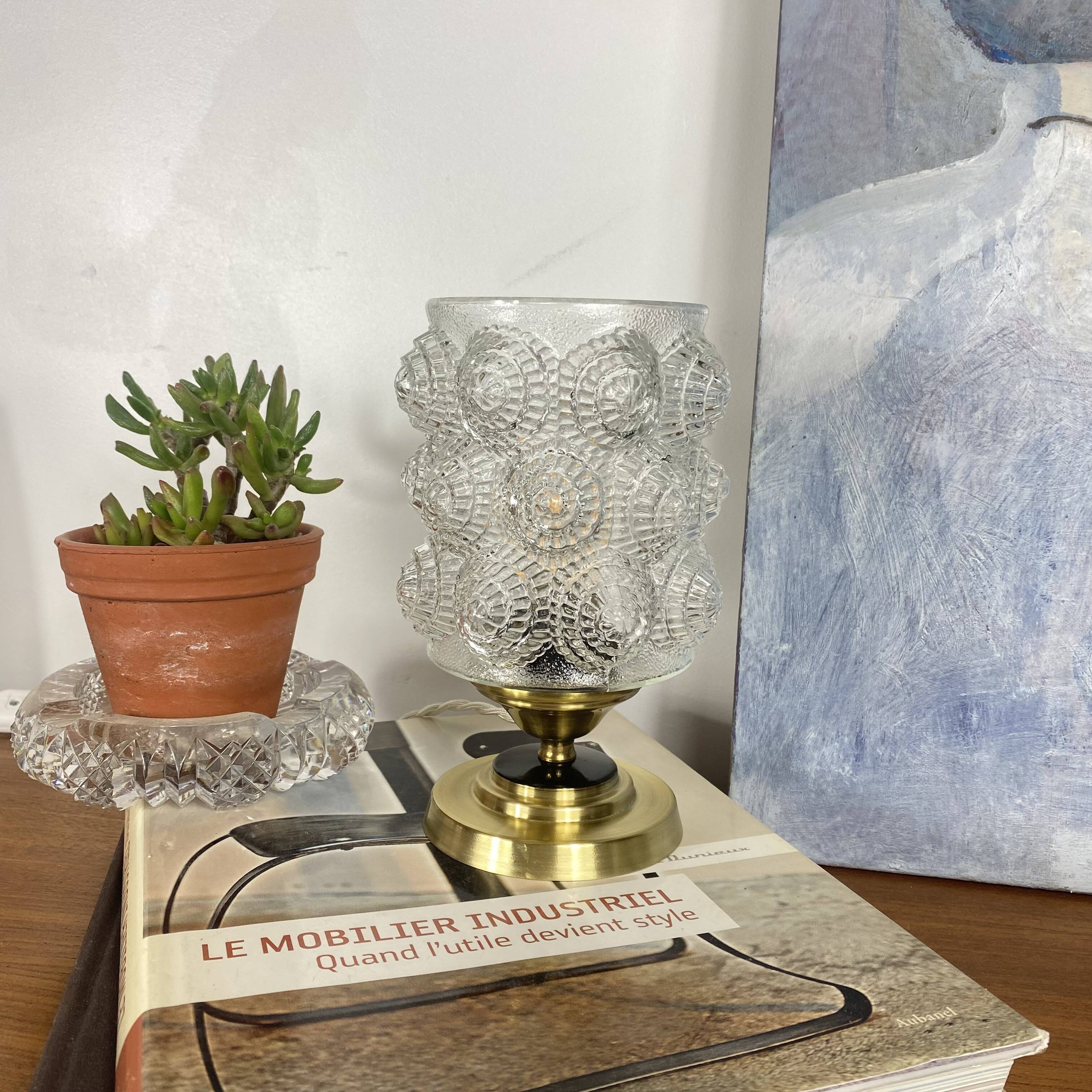 Antique globe table lamp in moulded transparent glass with a brass base.