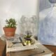 Antique globe table lamp in moulded transparent glass with a brass base.