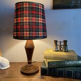 Turned wooden lamp, tartan lampshade.