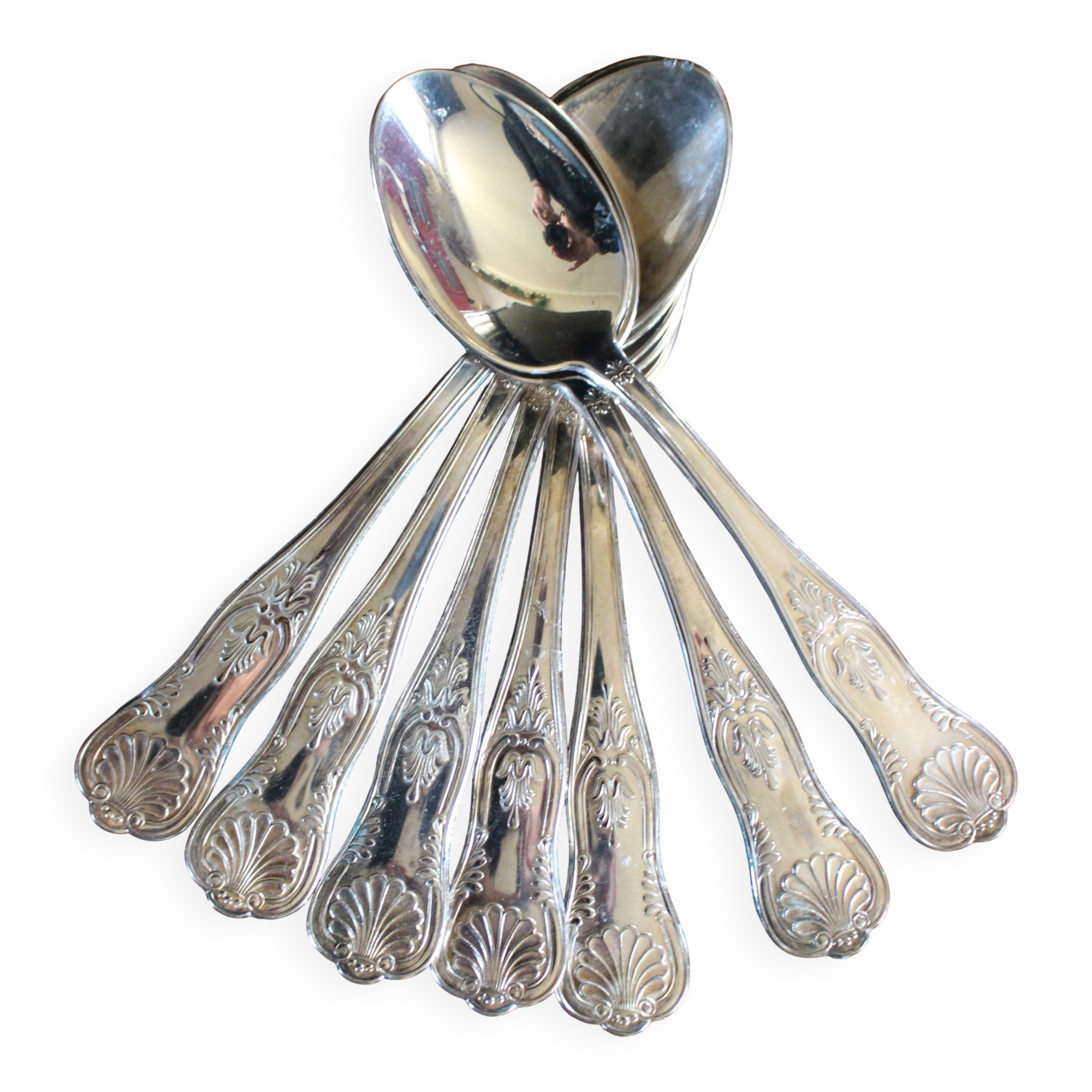 A set of 7 large metal shell spoons