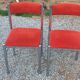 Pair of designer chairs in chrome metal and orange velvet from the 1970s.